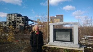 Deirdre Jolley, EPCAMR's newest Part-Time Bookkeeper gets her profile picture taken in the brisk air at the Huber Miner's Memorial Park with the Huber Breaker in the background outside the EPCAMR Office
