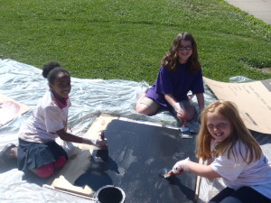 Leo E. Solomon-Plains 6th Grade Elementary Students painting one of the Solar Kiln doors.