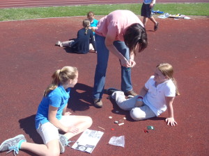Ann Devine-PA DEP EE Coordinator working with students to help them build their solar powered race cars.