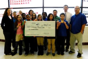 Students gather with PPL, EPCAMR, and W-B Area School District at Leo E. Solomon Plains to receive the grant check.