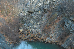 Hundreds, perhaps thousands of tires lie in the bottom of the mine hole in Plymouth off of Jersey Road and Route 11. (Edward Pikulski)